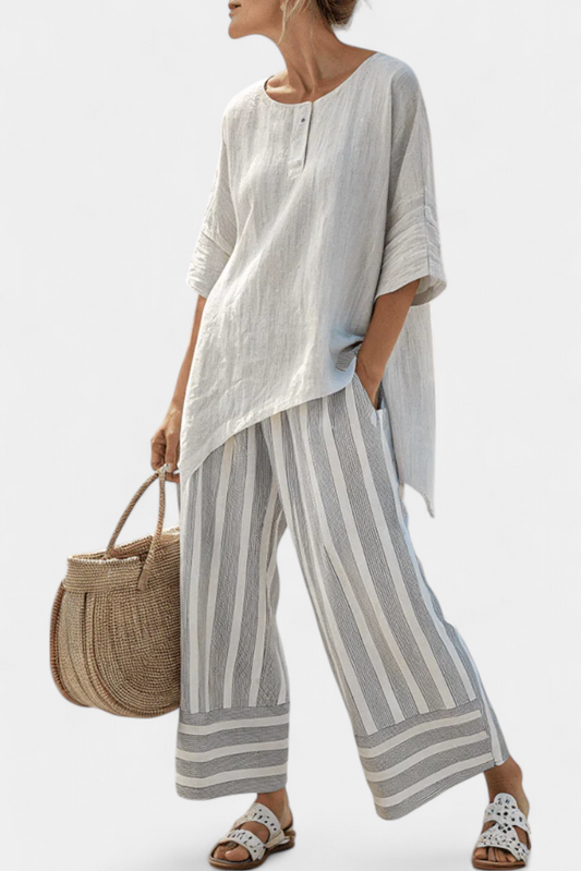 Talvora | Eleganten komplet z asimetrično bluzo in črtastimi hlačami